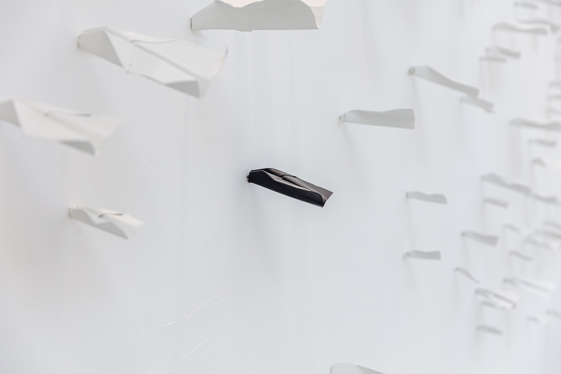 PAPER PLANES SIMULTANEOUSLY HITTING THE WALL